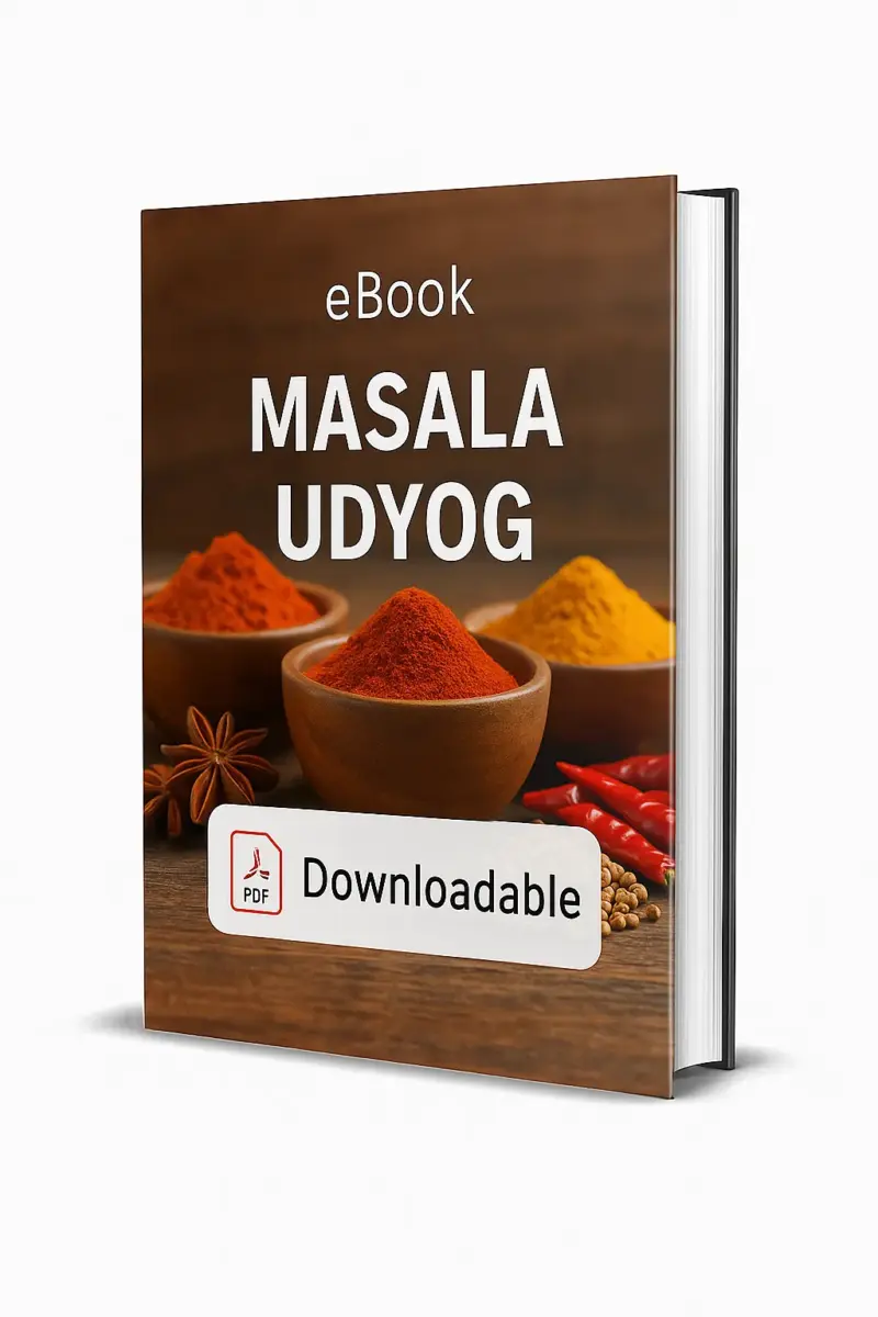 3D-rendered eBook cover for "Masala Udyog." The cover shows wooden bowls filled with colorful Indian spices — bright red chili powder, golden turmeric, and orange spice powders. Whole spices like red chilies, coriander seeds, and star anise are scattered on the wooden surface. The title text reads “eBook MASALA UDYOG” in bold white font, and a PDF icon with the word “Downloadable” is displayed at the bottom.