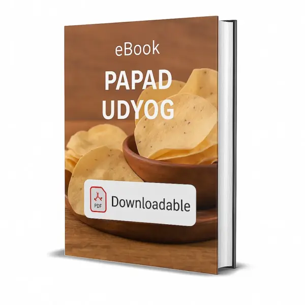 3D-rendered eBook cover for "Papad Udyog." The cover shows a wooden bowl filled with round, crispy papads stacked together, with additional papads scattered around on a wooden surface. The background is warm and rustic. The title text reads “eBook PAPAD UDYOG” in bold white font, and a PDF icon with the word “Downloadable” is displayed at the bottom.