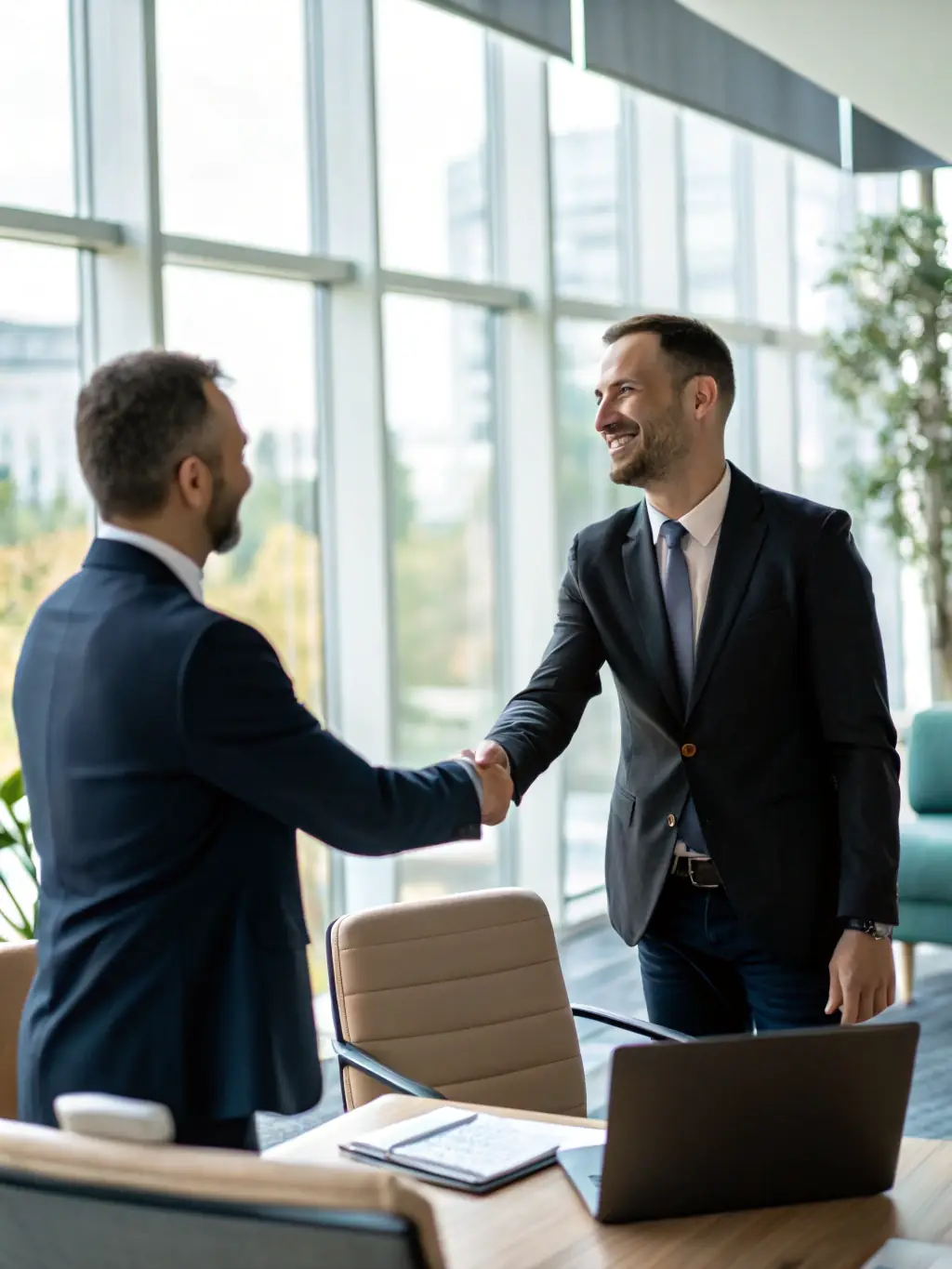 An image of a satisfied client shaking hands with CA Manish Gugliya, representing successful project report outcomes and client satisfaction.